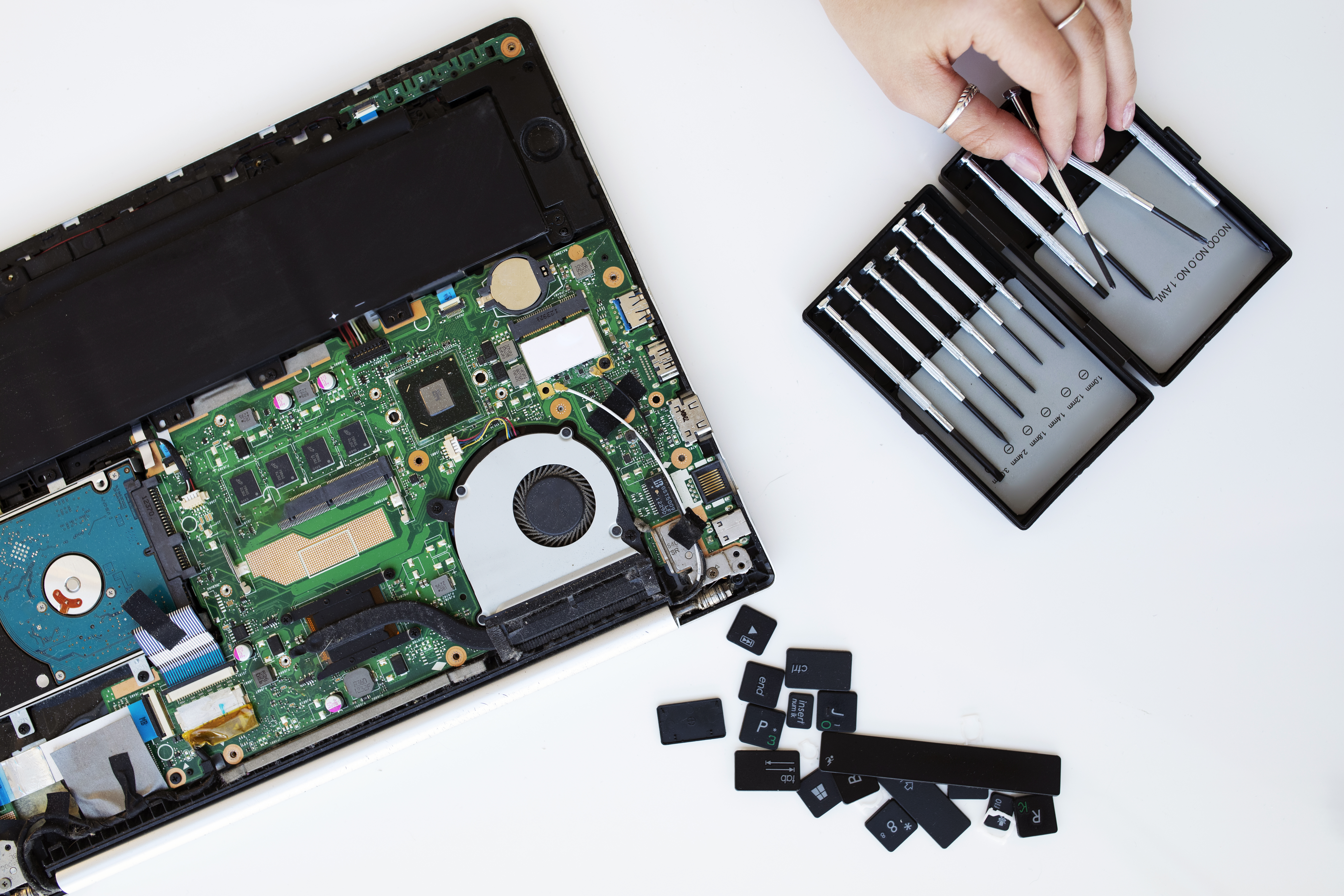 Technician performing electronic device repair